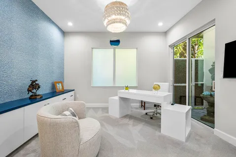 an aerial view of a house with a garden