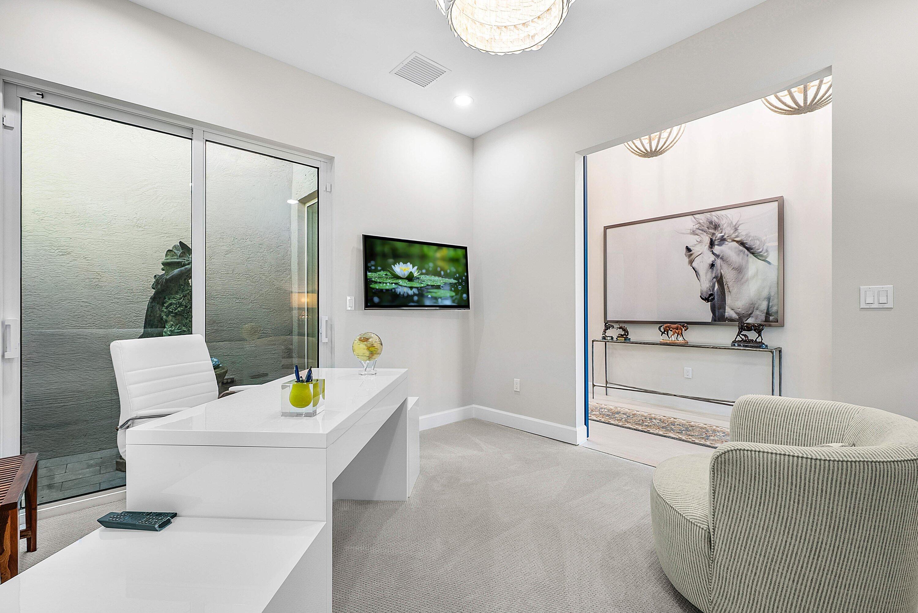 12626 Parrot Pond Road Boynton Beach, FL 33473 - Photo 38 of 67 a living room with furniture and a flat screen tv