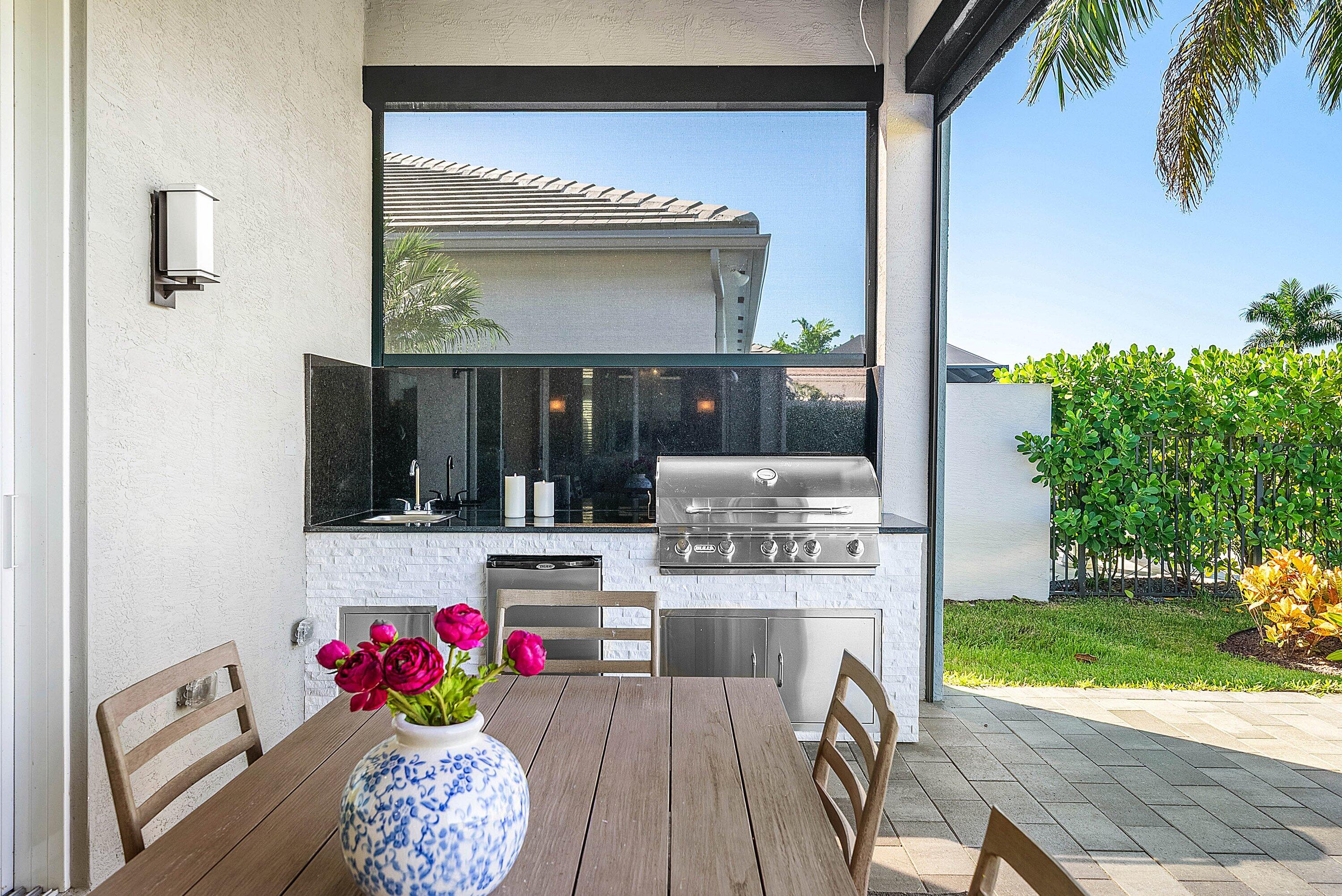 12626 Parrot Pond Road Boynton Beach, FL 33473 - Photo 40 of 67 a view of kitchen with kitchen island dining table and chairs