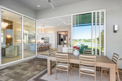 an aerial view of a houses with a lake view