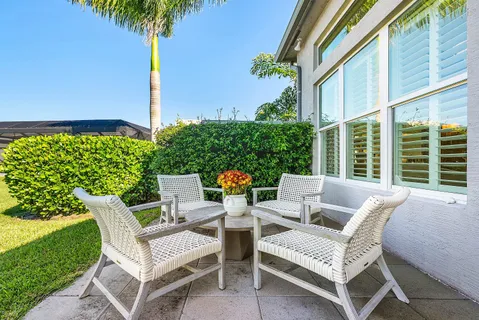 an aerial view of a residential houses with outdoor space and a lake view