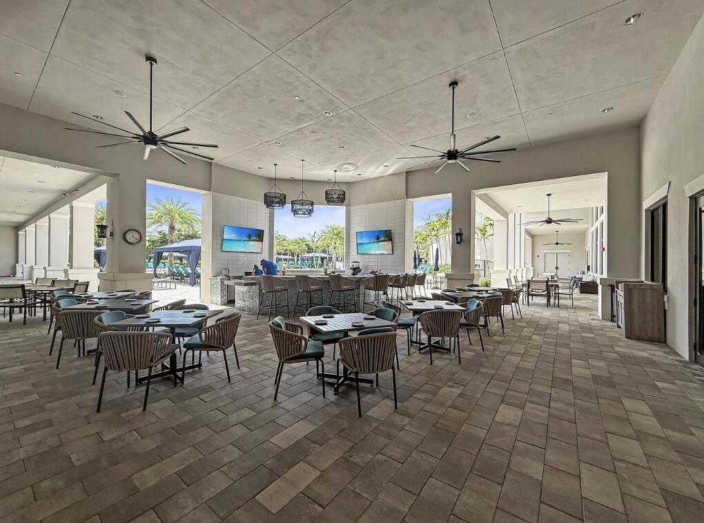 12626 Parrot Pond Road Boynton Beach, FL 33473 - Photo 64 of 67 a view of a dining area with furniture