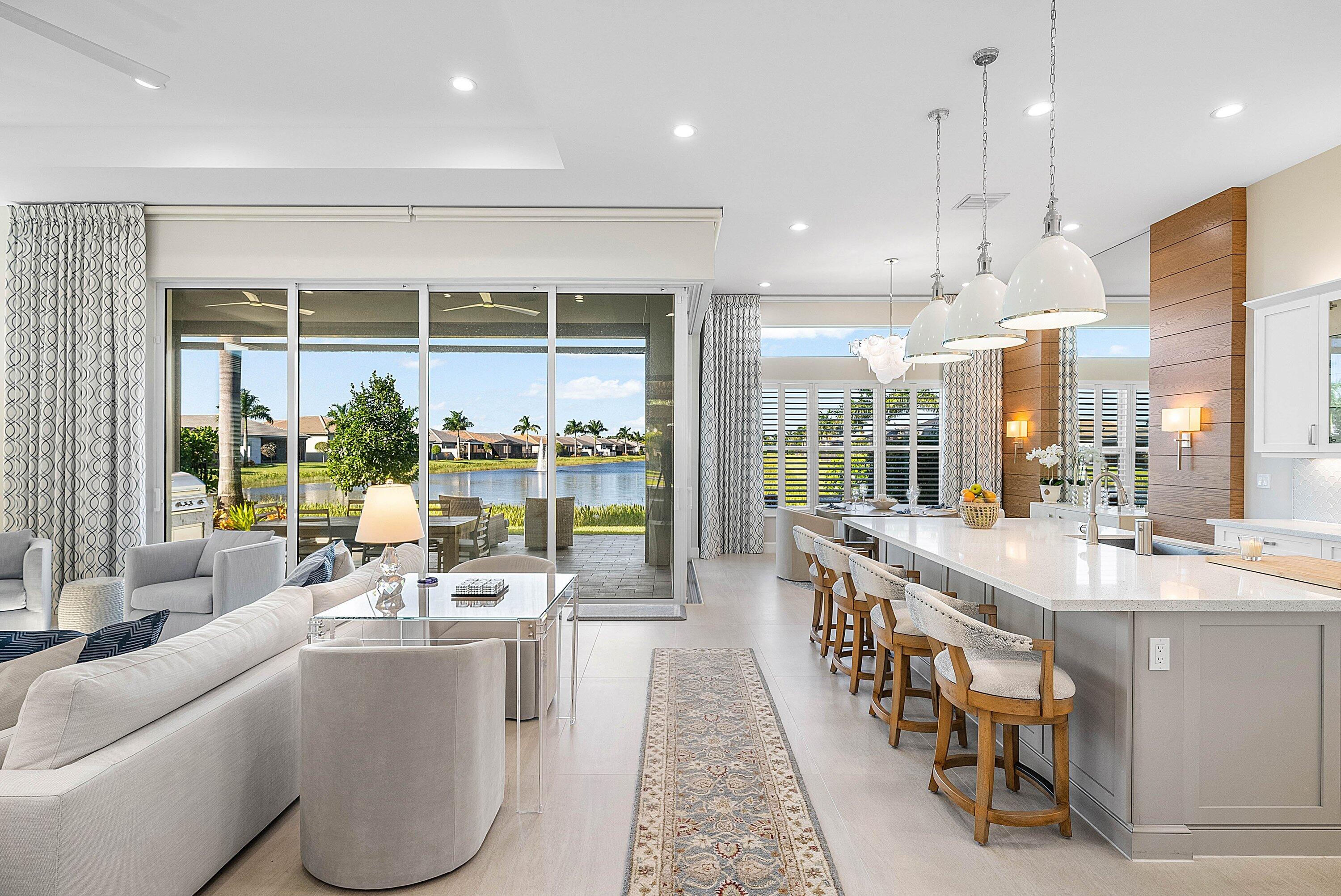 12626 Parrot Pond Road Boynton Beach, FL 33473 - Photo 7 of 67 a large dining hall with stainless steel appliances granite countertop a lot of cabinets a sink and a large window