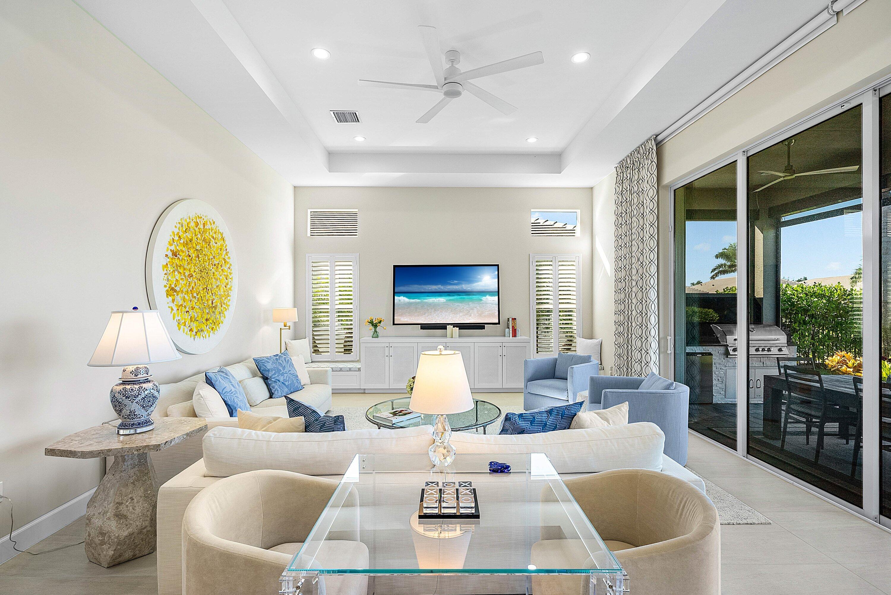 12626 Parrot Pond Road Boynton Beach, FL 33473 - Photo 8 of 67 a living room with furniture a fireplace and a chandelier