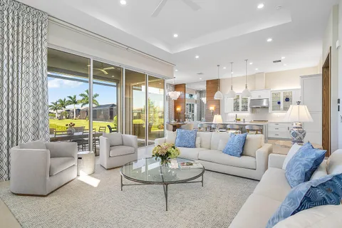 a large kitchen with a table and chairs