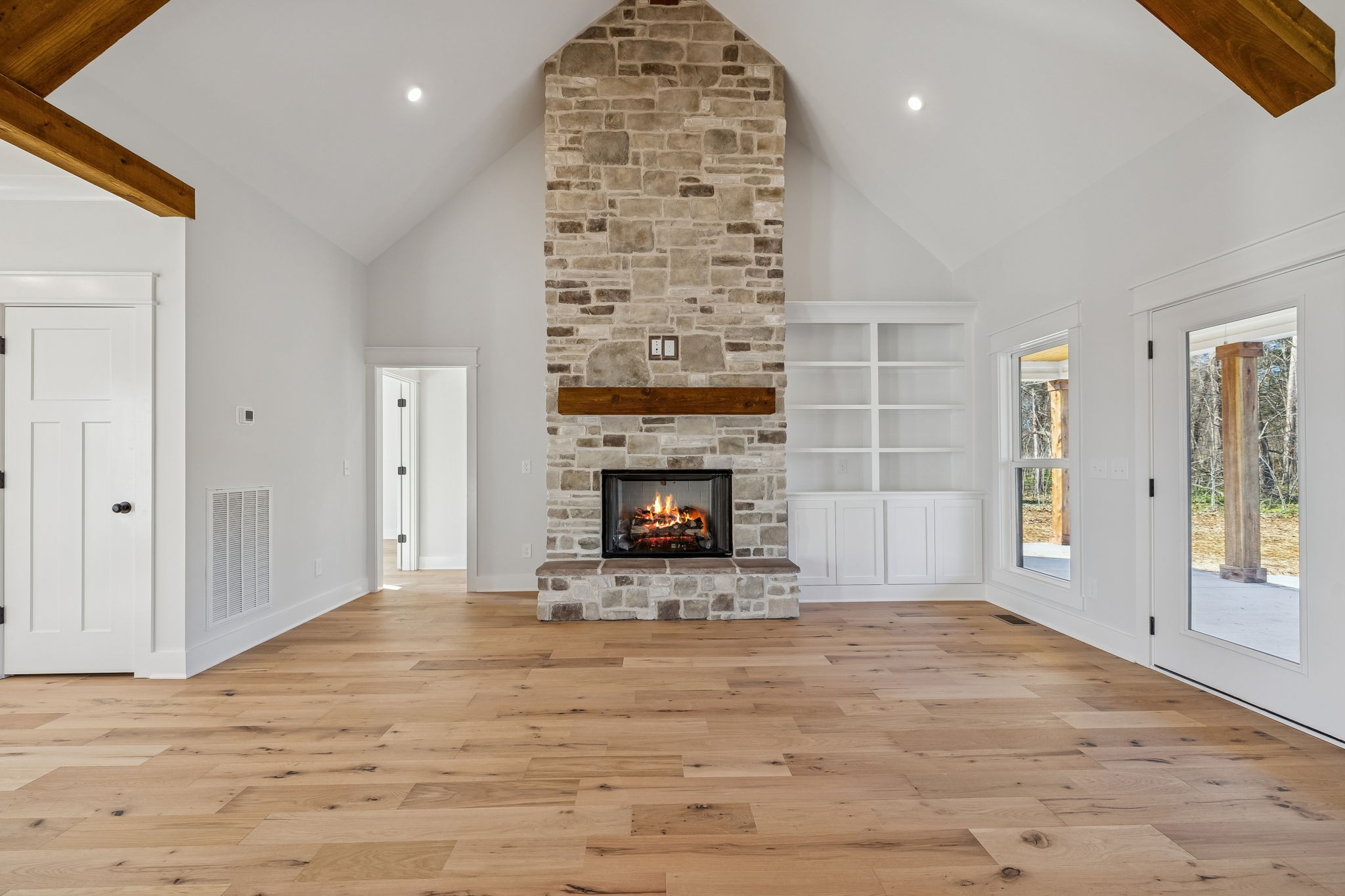 8533 Twelve Corners Road Lascassas, TN 37085 - Photo 11 of 79 a view of an empty room with a fireplace and a window