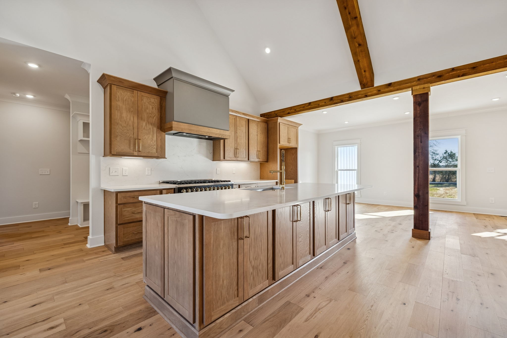 8533 Twelve Corners Road Lascassas, TN 37085 - Photo 21 of 79 a kitchen with stainless steel appliances granite countertop a sink stove and wooden floor