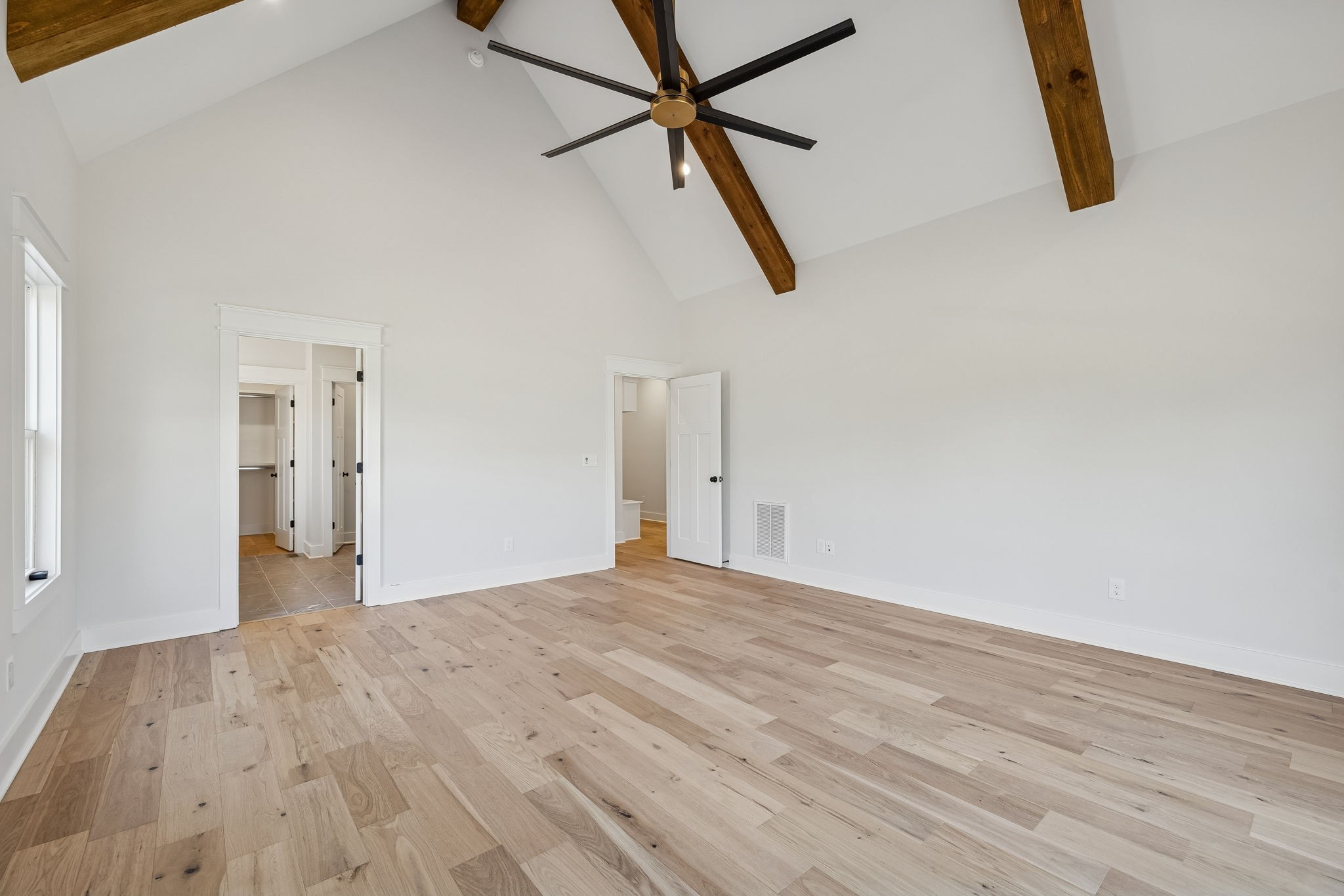8533 Twelve Corners Road Lascassas, TN 37085 - Photo 33 of 79 a view of empty room with wooden floor and ceiling fan