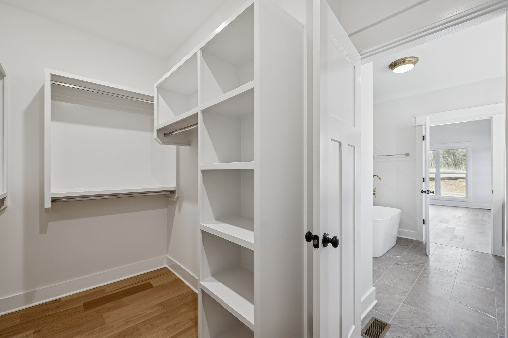 8533 Twelve Corners Road Lascassas, TN 37085 - Photo 40 of 79 a view of a hallway with wooden floor and staircase
