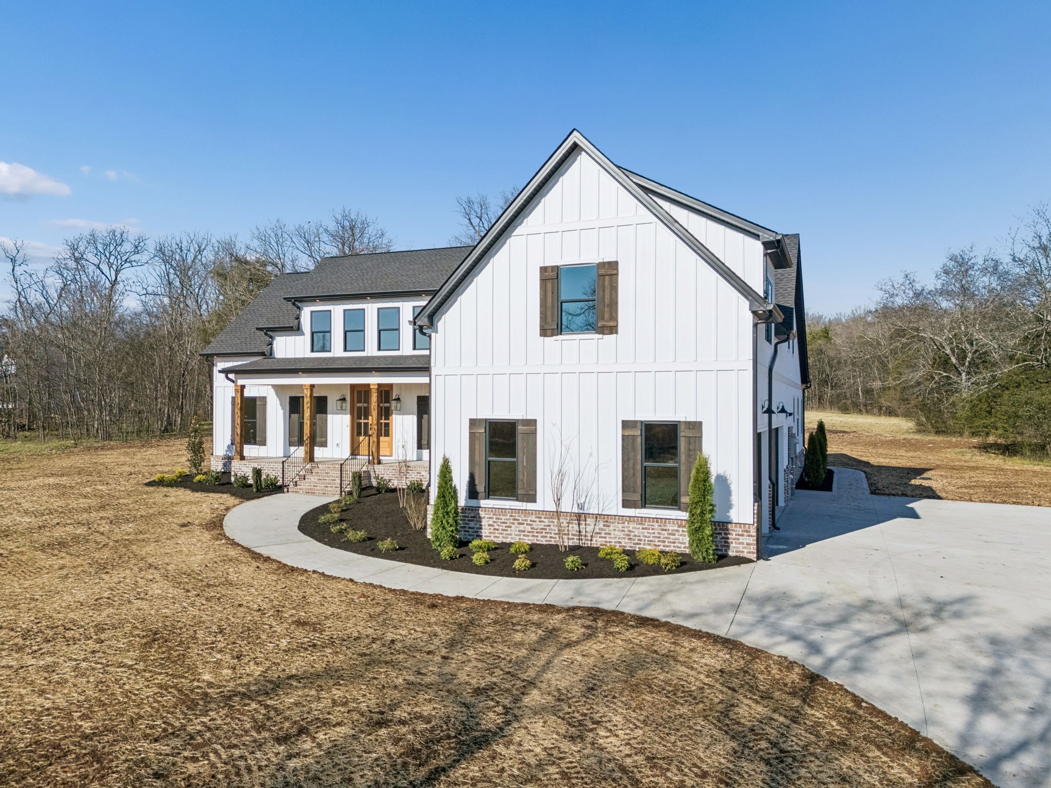 8533 Twelve Corners Road Lascassas, TN 37085 - Photo 4 of 79 a front view of a house with a yard and garage