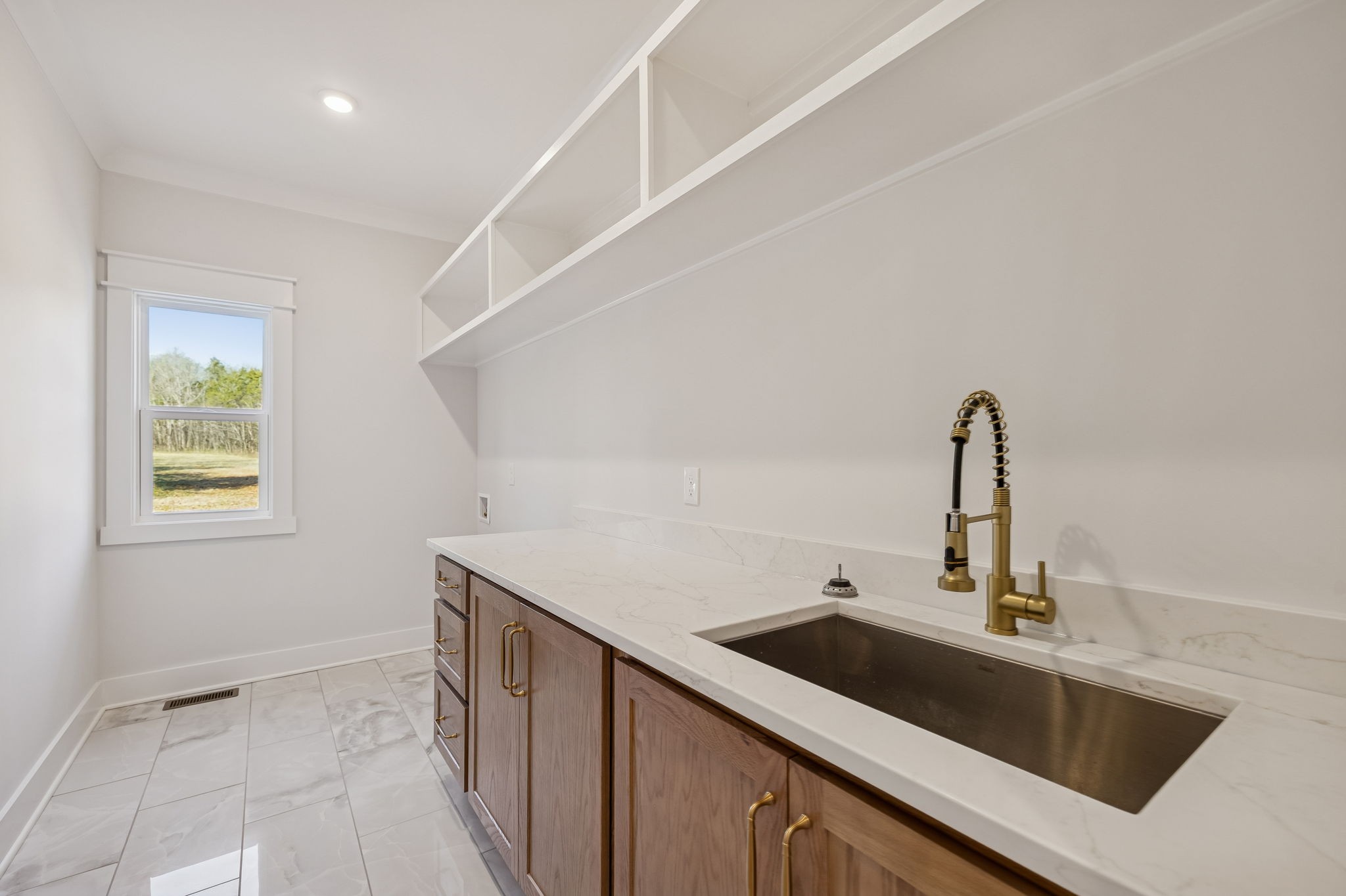 8533 Twelve Corners Road Lascassas, TN 37085 - Photo 42 of 79 a kitchen with a sink and cabinets