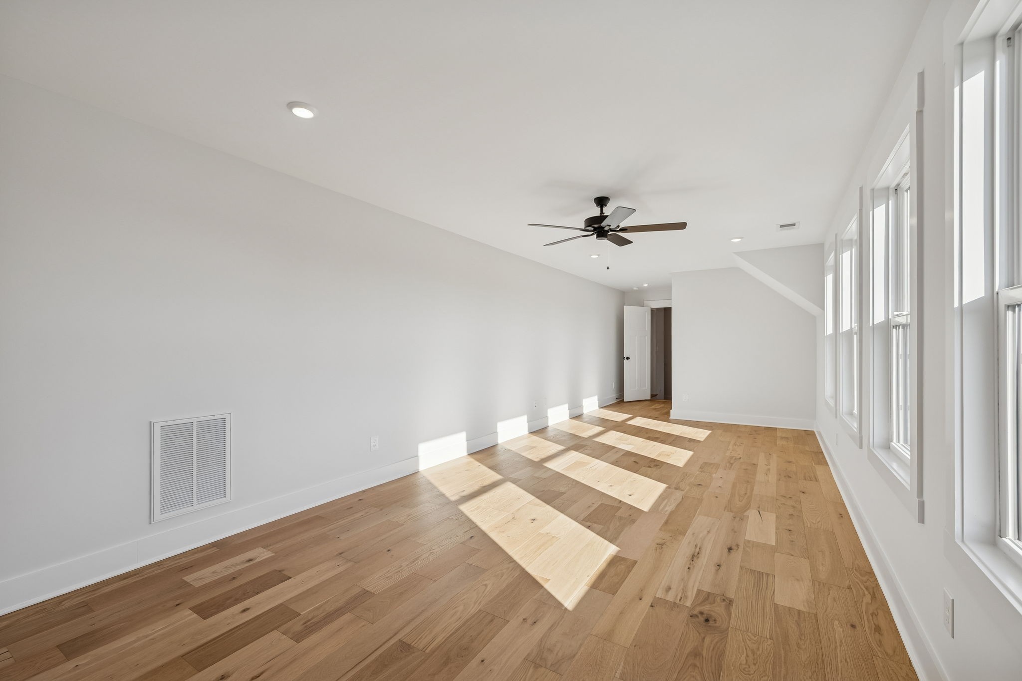 8533 Twelve Corners Road Lascassas, TN 37085 - Photo 55 of 79 a view of a room with wooden floor and ceiling fan