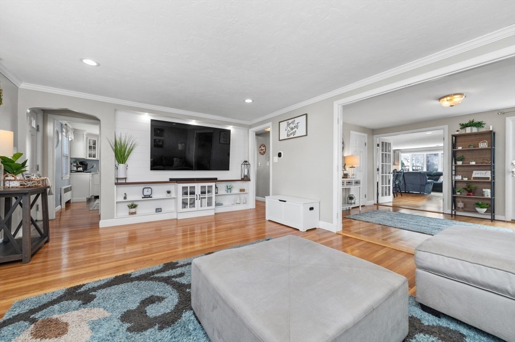 10 Shade Street Waltham, MA 02452 - Photo 11 of 33 a living room with furniture and a flat screen tv