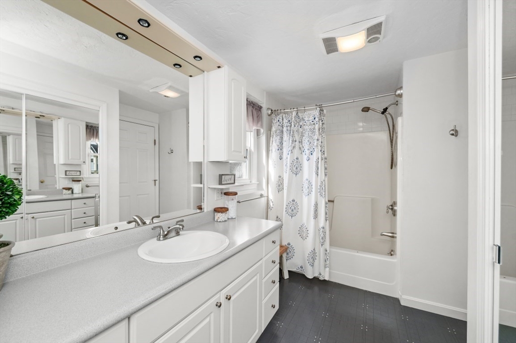 10 Shade Street Waltham, MA 02452 - Photo 18 of 33 a bathroom with a sink double vanity and a mirror