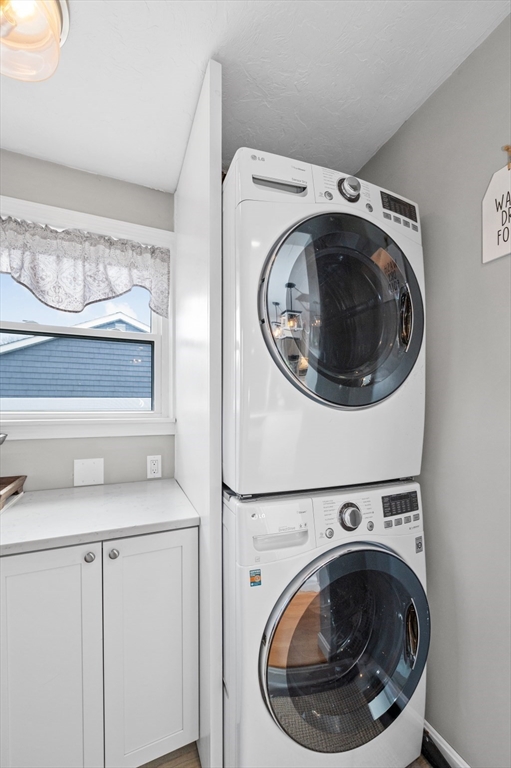 10 Shade Street Waltham, MA 02452 - Photo 20 of 33 a utility room with dryer and washer