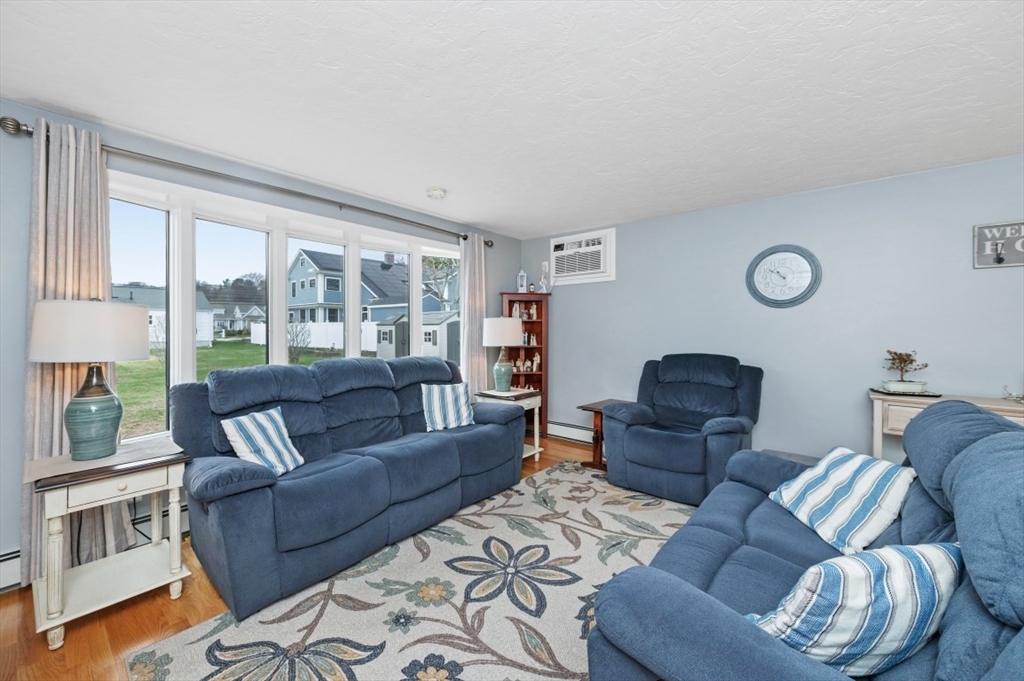 10 Shade Street Waltham, MA 02452 - Photo 24 of 33 a living room with furniture and a window