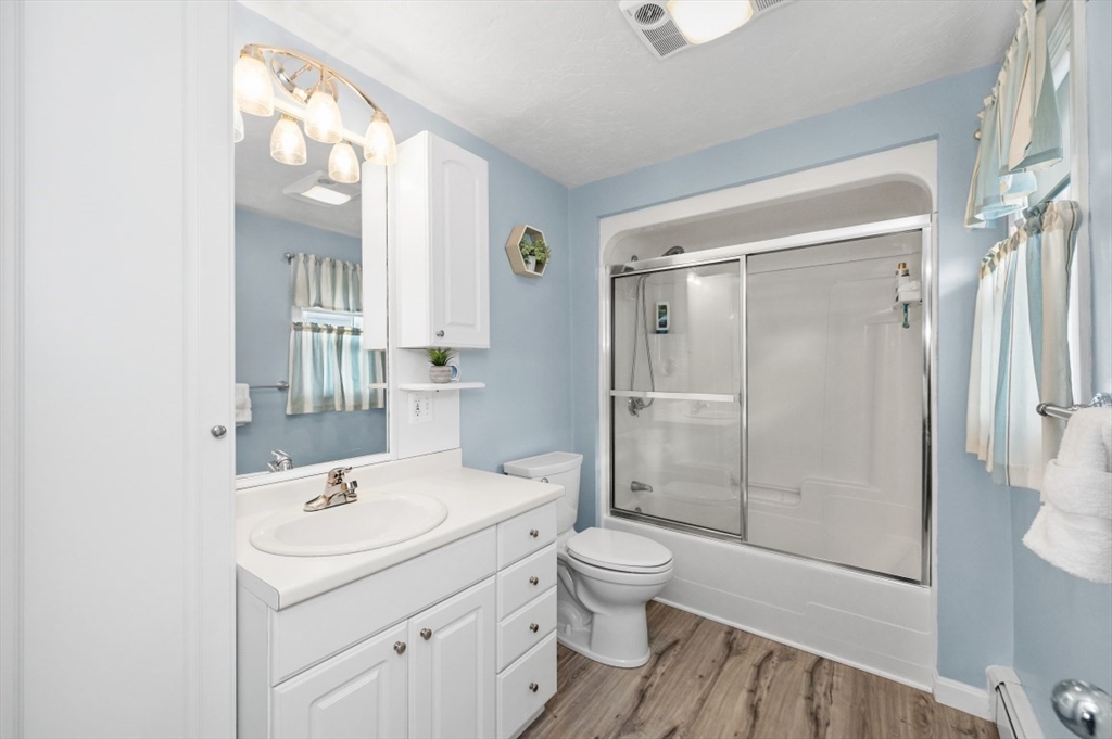 10 Shade Street Waltham, MA 02452 - Photo 27 of 33 a bathroom with a sink toilet and shower