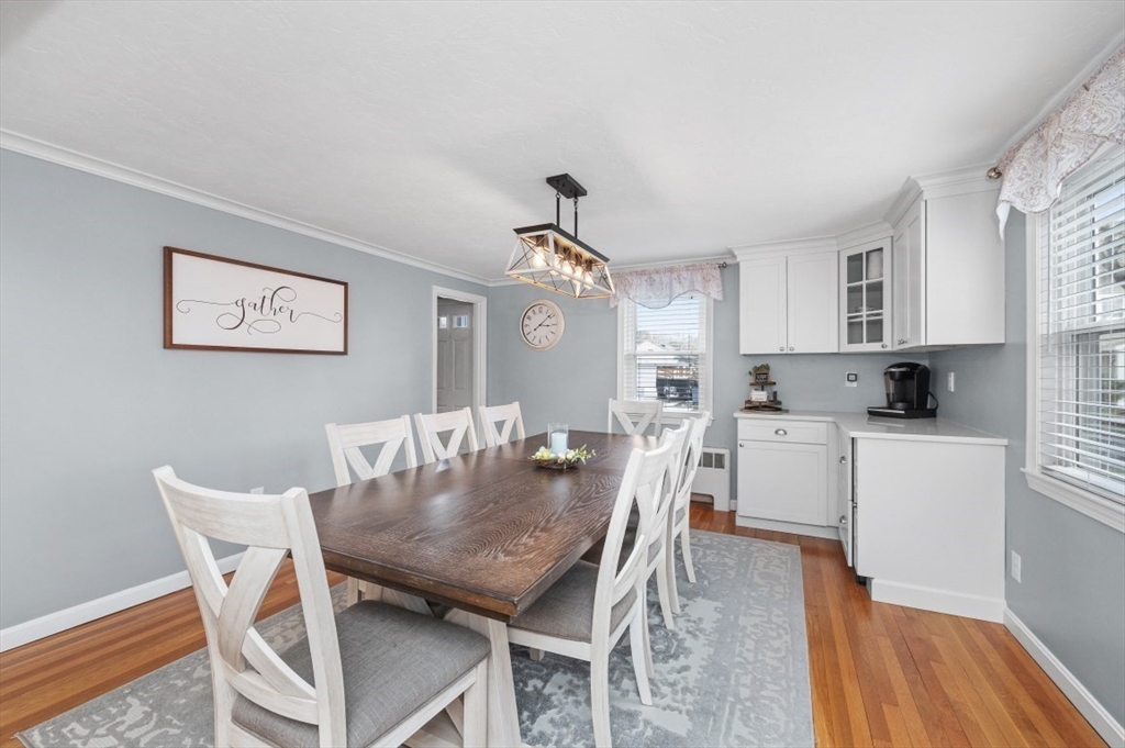 10 Shade Street Waltham, MA 02452 - Photo 8 of 33 a view of a dining room with furniture and wooden floor