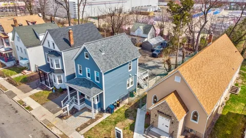 a aerial view of a house with large trees