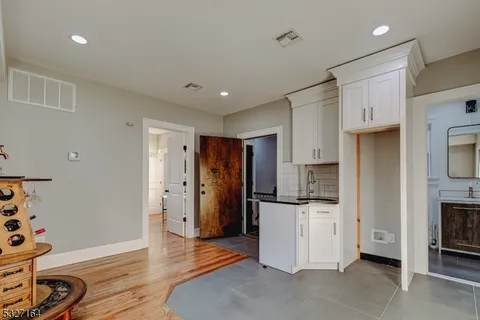 a kitchen with stainless steel appliances a refrigerator sink and cabinets