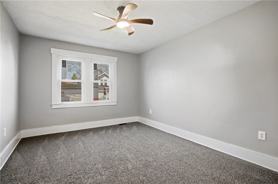 1925 Sunset Avenue Springfield, OH 45505 - Photo 29 of 45 This spacious bedroom offers ample natural light and plush carpeting, creating a comfortable living space.