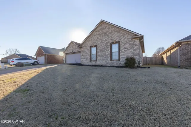 an empty room with wooden floor