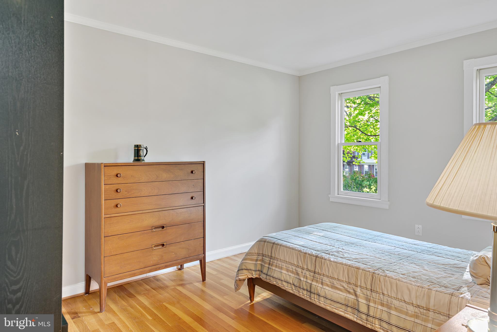 223 Summit Hall Road Gaithersburg, MD 20877 - Photo 28 of 60 a bedroom with a bed and a dresser