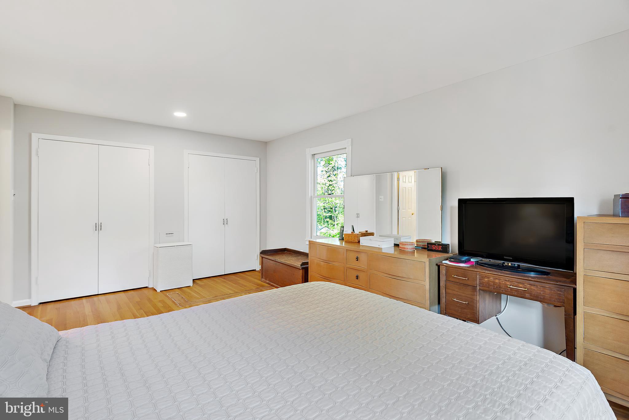 223 Summit Hall Road Gaithersburg, MD 20877 - Photo 38 of 60 a bedroom with a bed and a flat screen tv