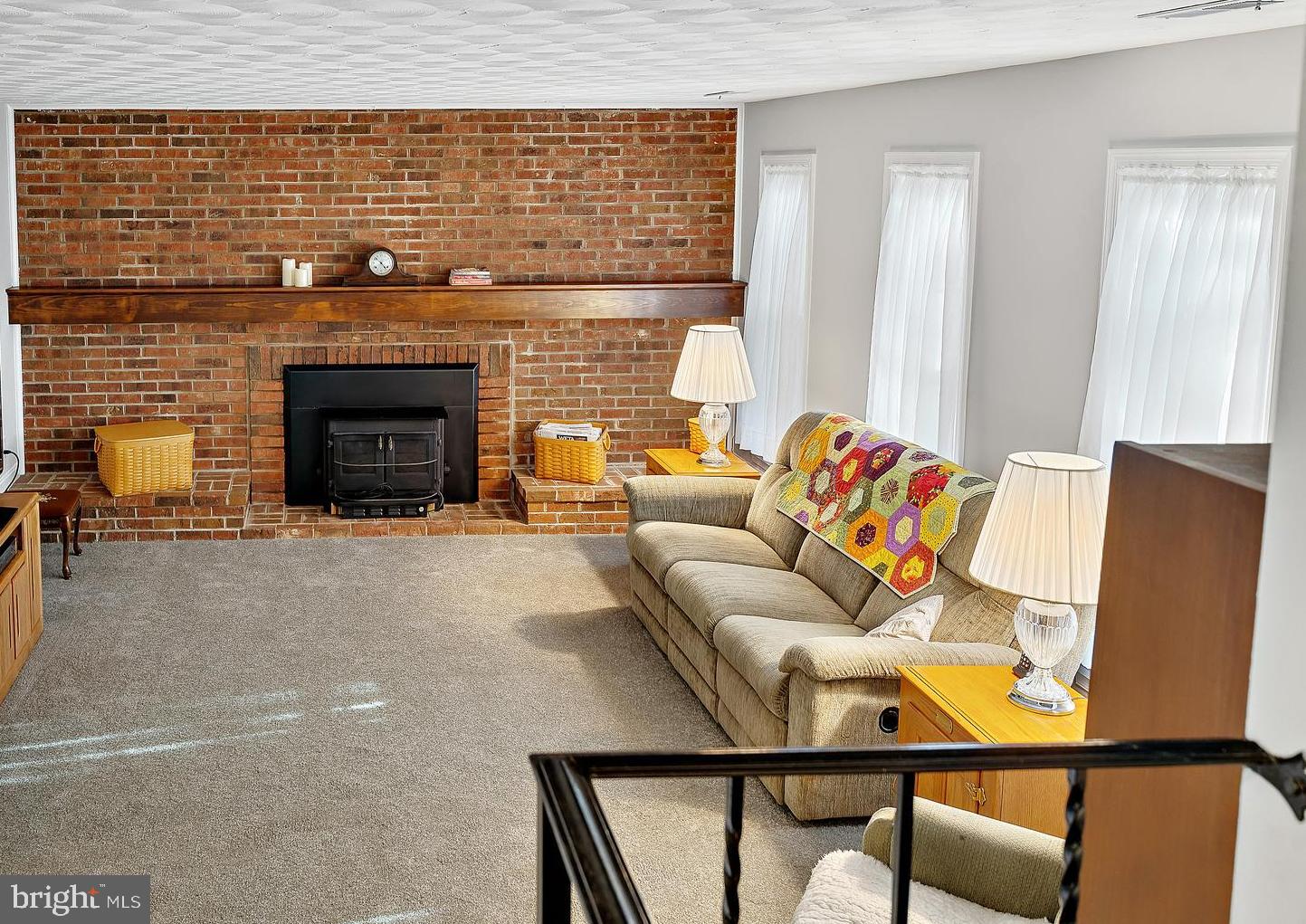 223 Summit Hall Road Gaithersburg, MD 20877 - Photo 43 of 60 a living room with furniture and a fireplace