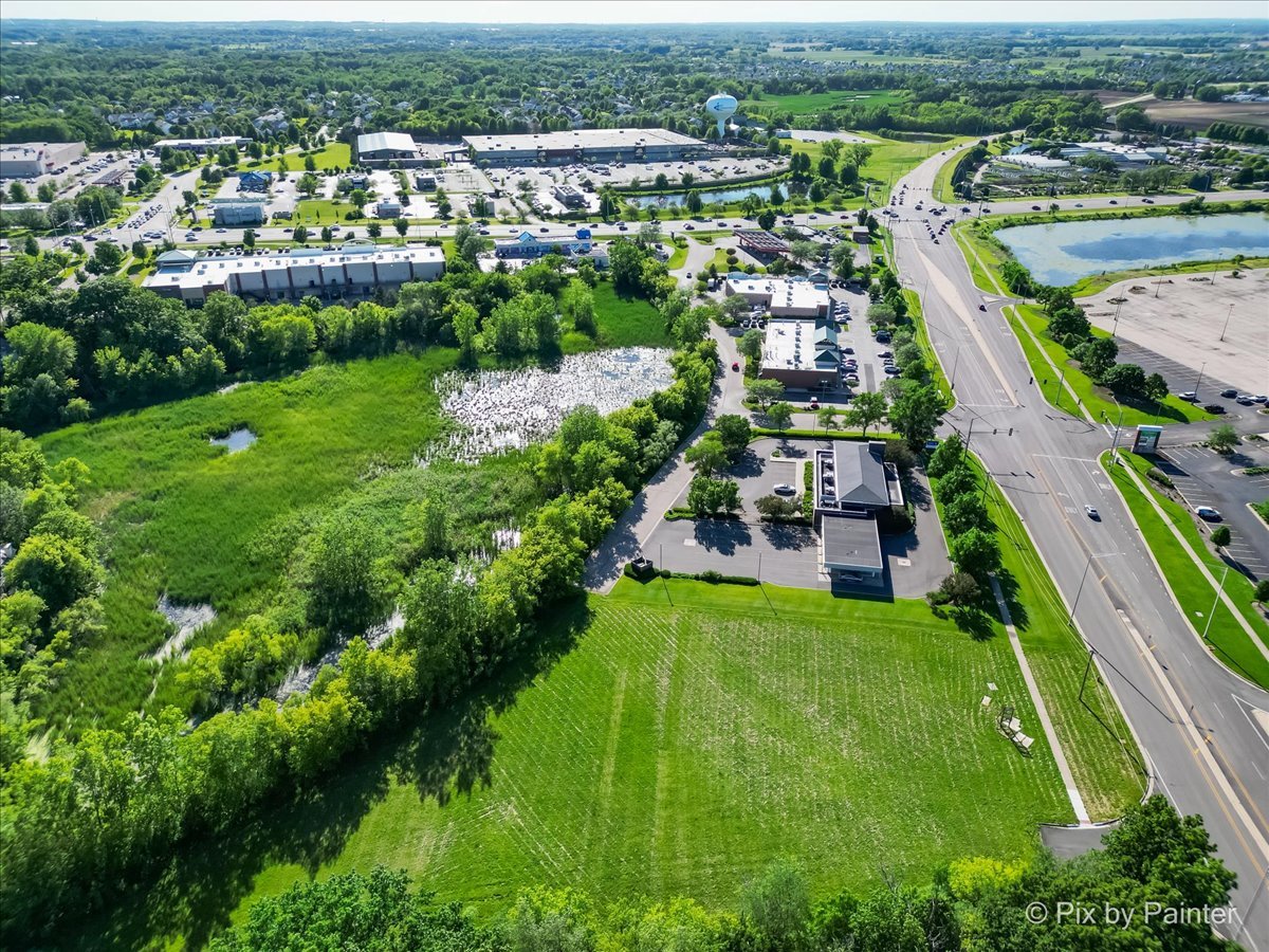6850 Huntley Road Carpentersville, IL 60110 - Photo 13 of 16 an aerial view of residential houses with outdoor space and river