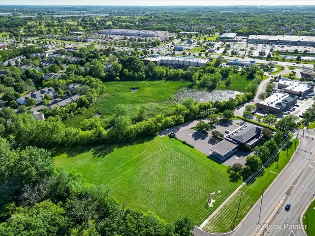 an aerial view of a house with a garden