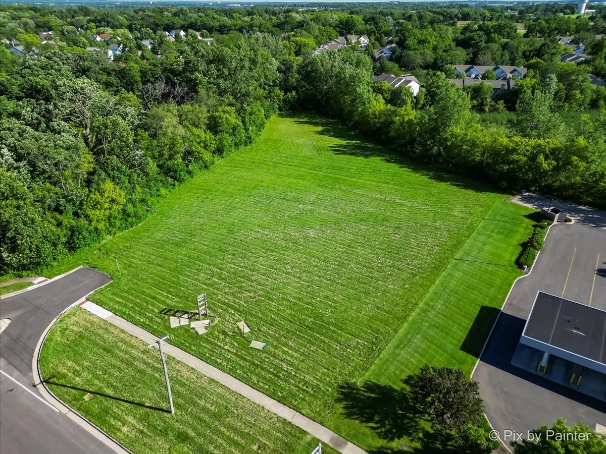 6850 Huntley Road Carpentersville, IL 60110 - Photo 3 of 16 a view of a golf club with a yard