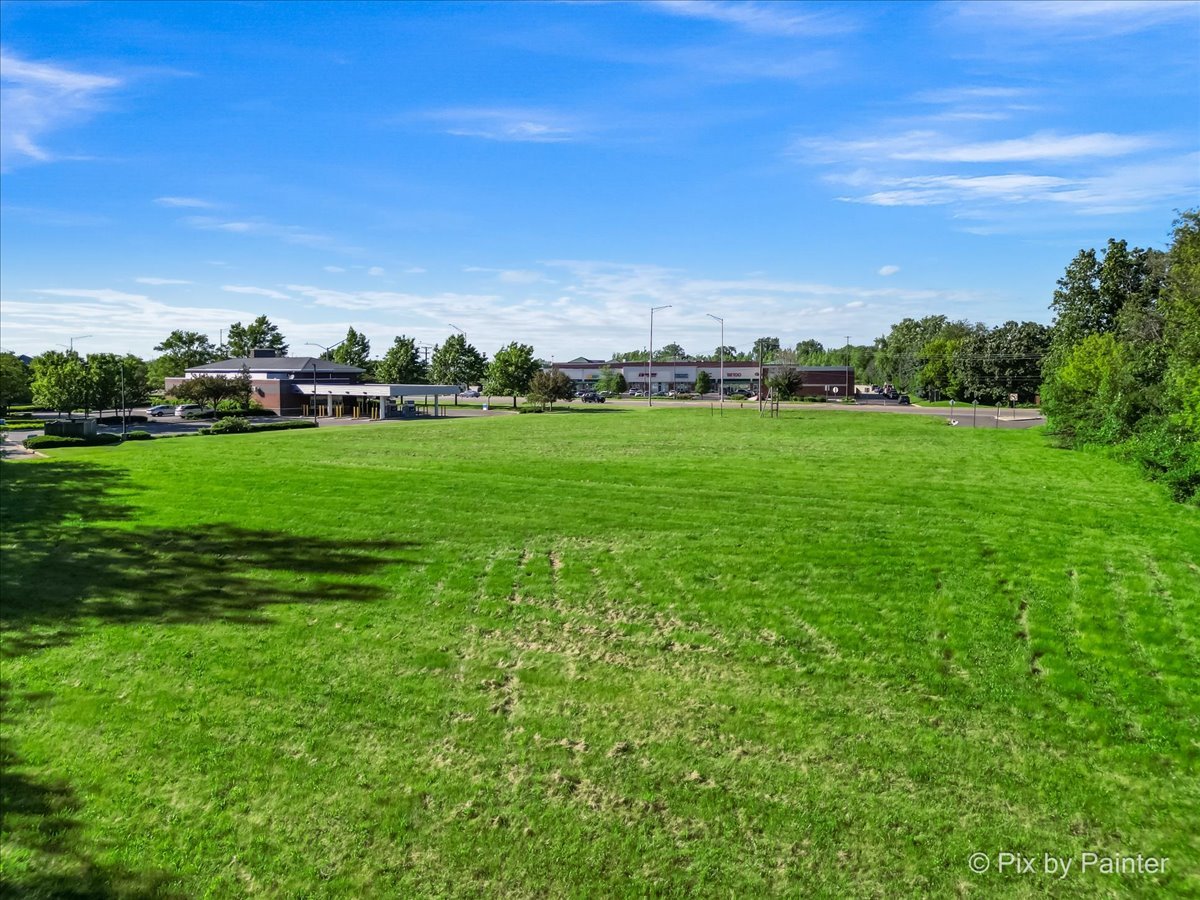 6850 Huntley Road Carpentersville, IL 60110 - Photo 6 of 16 a view of a grassy field with trees