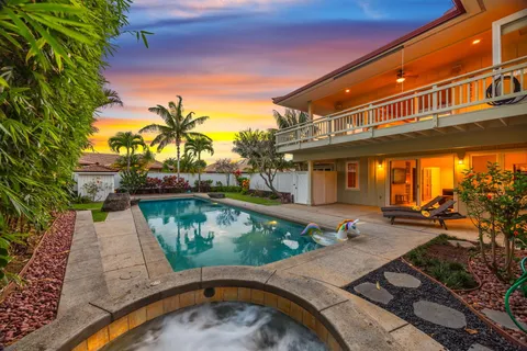 a view of swimming pool with a patio and a yard