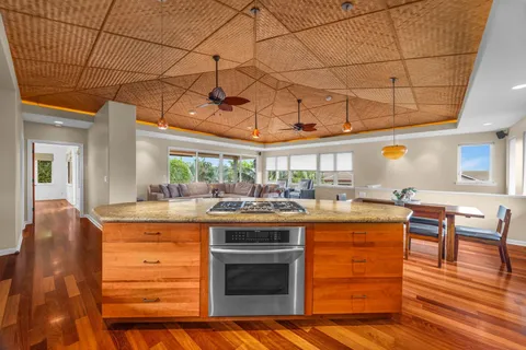 a kitchen with a stove and cabinets