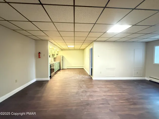 a view of a livingroom with wooden floor