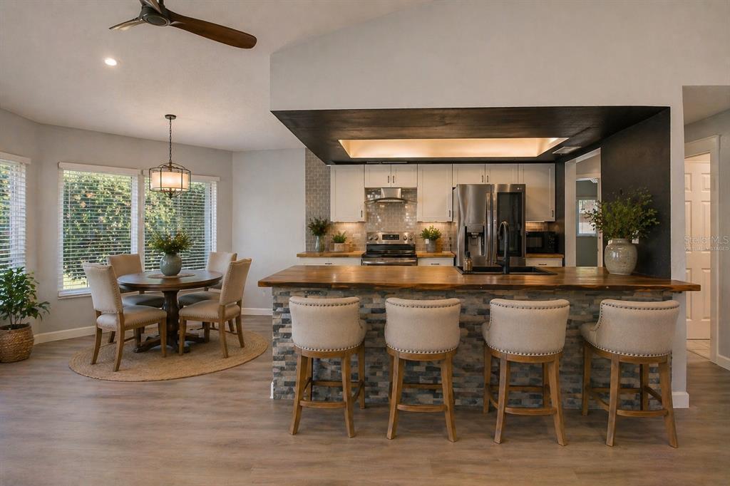 8285 Galgano Lane Spring Hill, FL 34606 - Photo 13 of 55 a dining table with chairs and window