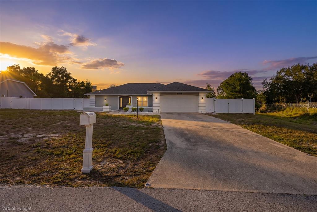 8285 Galgano Lane Spring Hill, FL 34606 - Photo 2 of 55 a front view of a house with a yard