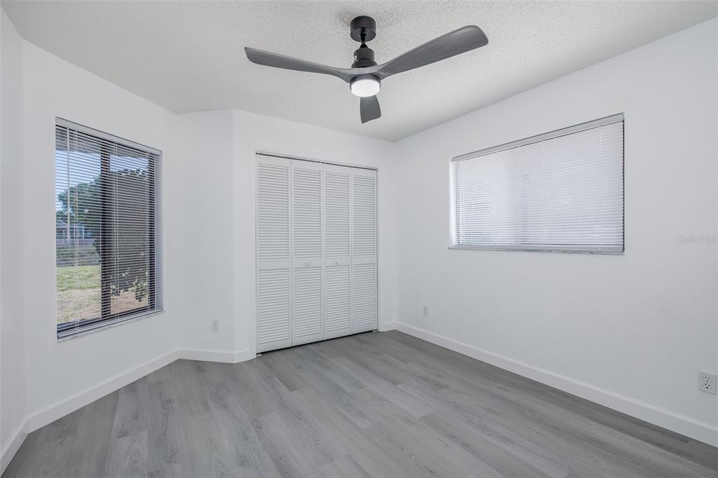 8285 Galgano Lane Spring Hill, FL 34606 - Photo 30 of 55 wooden floor in an empty room with a window