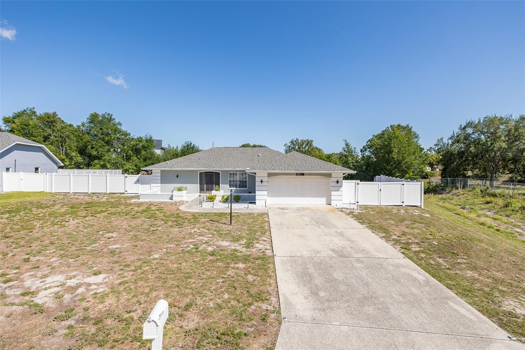 8285 Galgano Lane Spring Hill, FL 34606 - Photo 3 of 55 a front view of a house with yard