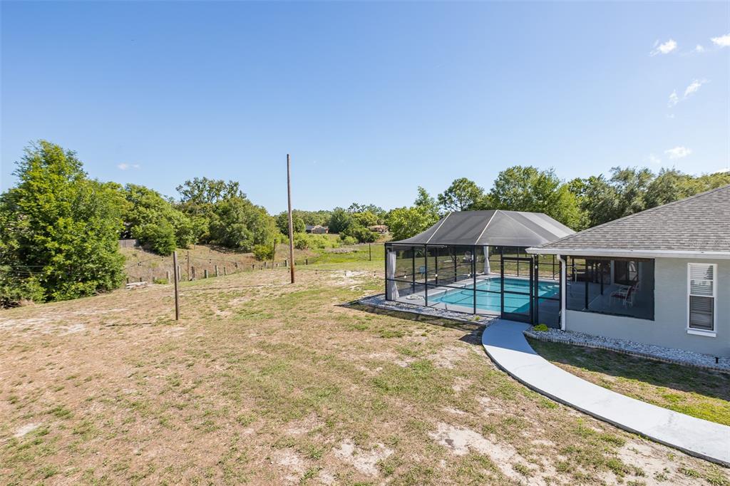 8285 Galgano Lane Spring Hill, FL 34606 - Photo 46 of 55 swimming pool view with a seating space