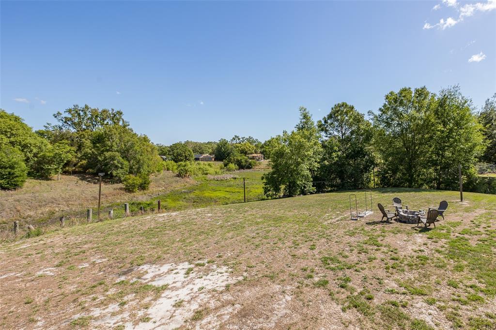 8285 Galgano Lane Spring Hill, FL 34606 - Photo 49 of 55 a view of dirt field with trees