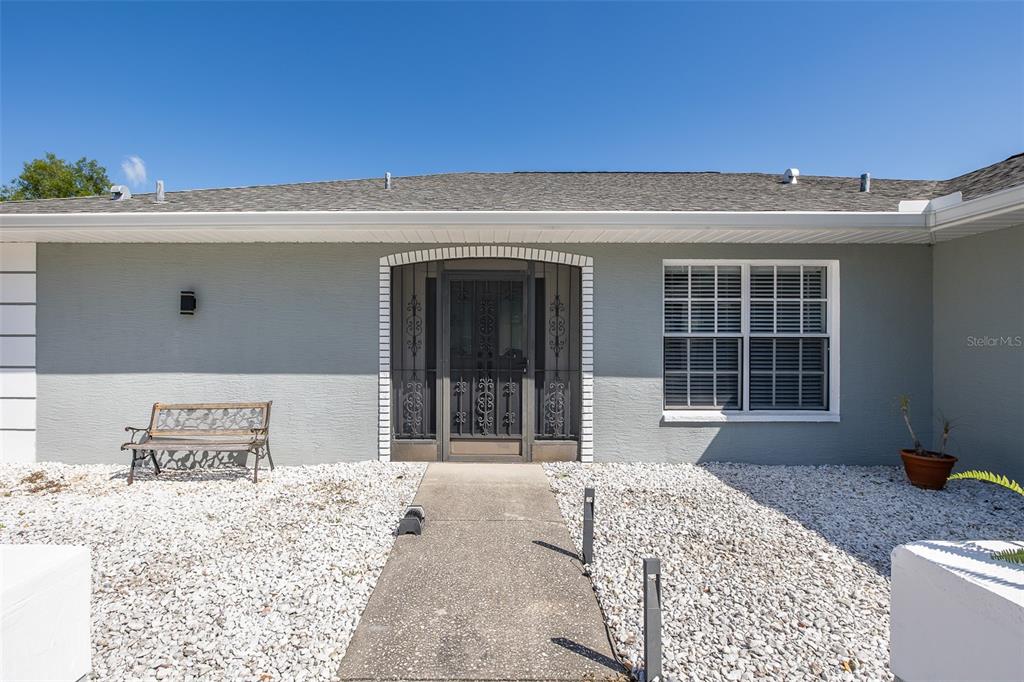 8285 Galgano Lane Spring Hill, FL 34606 - Photo 5 of 55 a front view of a house with a yard