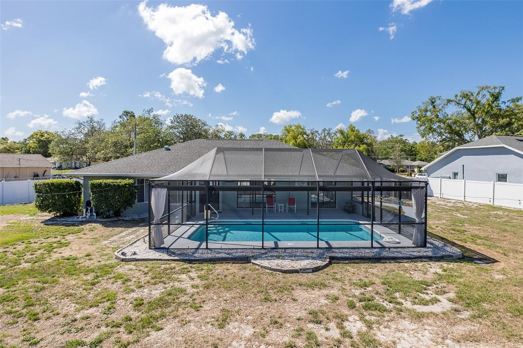 8285 Galgano Lane Spring Hill, FL 34606 - Photo 51 of 55 a view of a house with swimming pool and sitting area