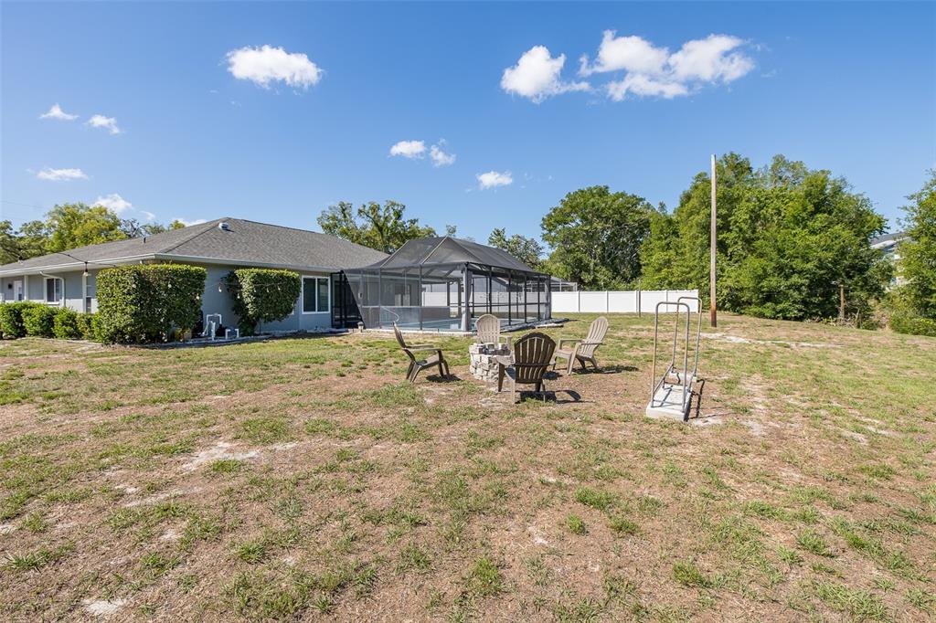 8285 Galgano Lane Spring Hill, FL 34606 - Photo 52 of 55 a view of a house with backyard porch and sitting area