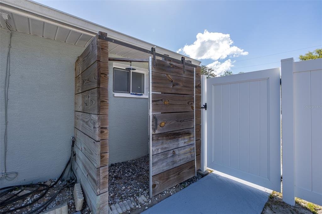 8285 Galgano Lane Spring Hill, FL 34606 - Photo 55 of 55 a view of walk in closet with empty racks