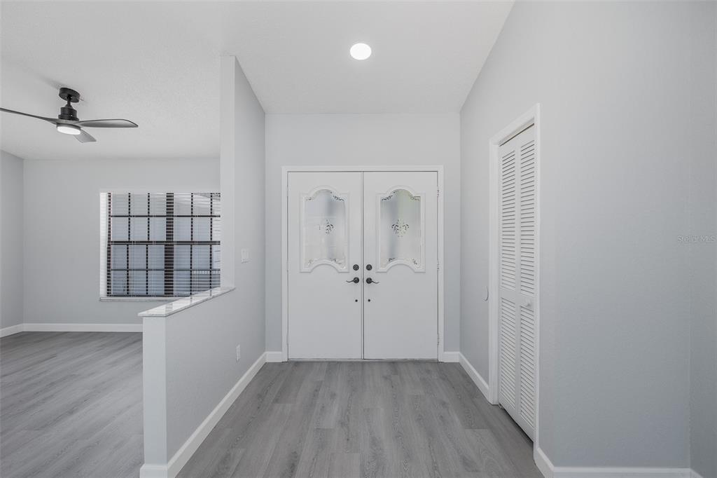 8285 Galgano Lane Spring Hill, FL 34606 - Photo 6 of 55 wooden floor in an empty room with a window