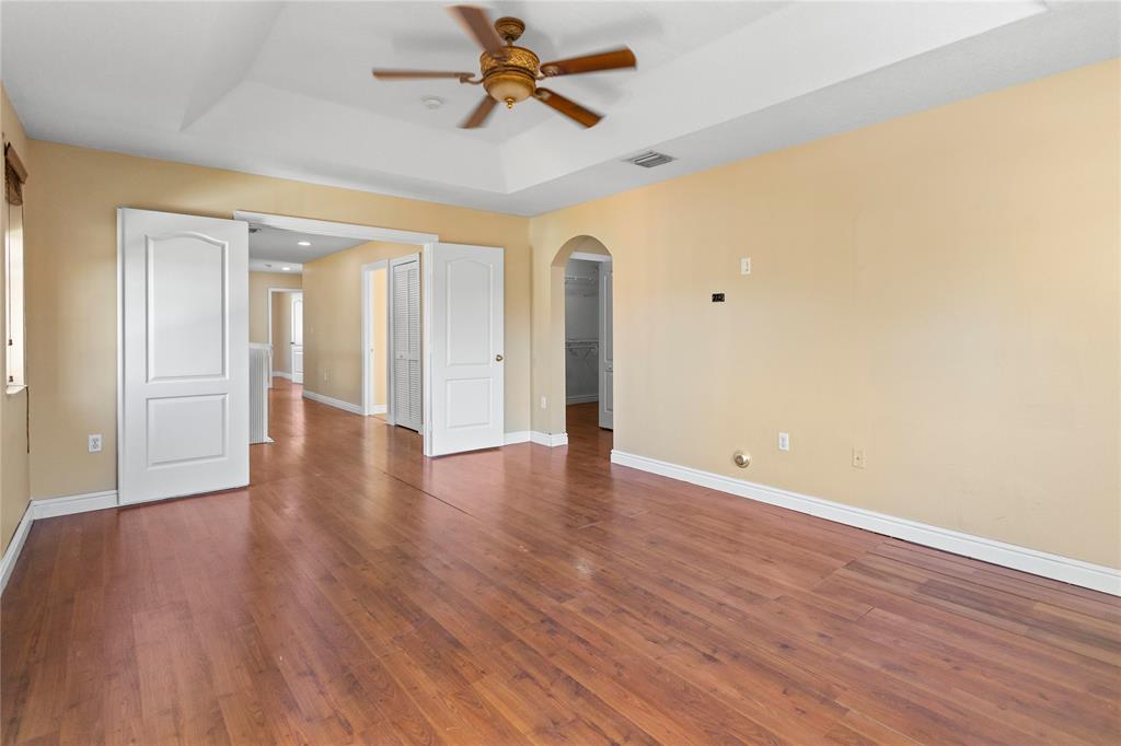 2704 Southwest 128th Avenue Miramar, FL 33027 - Photo 19 of 54 wooden floor in an empty room with a window