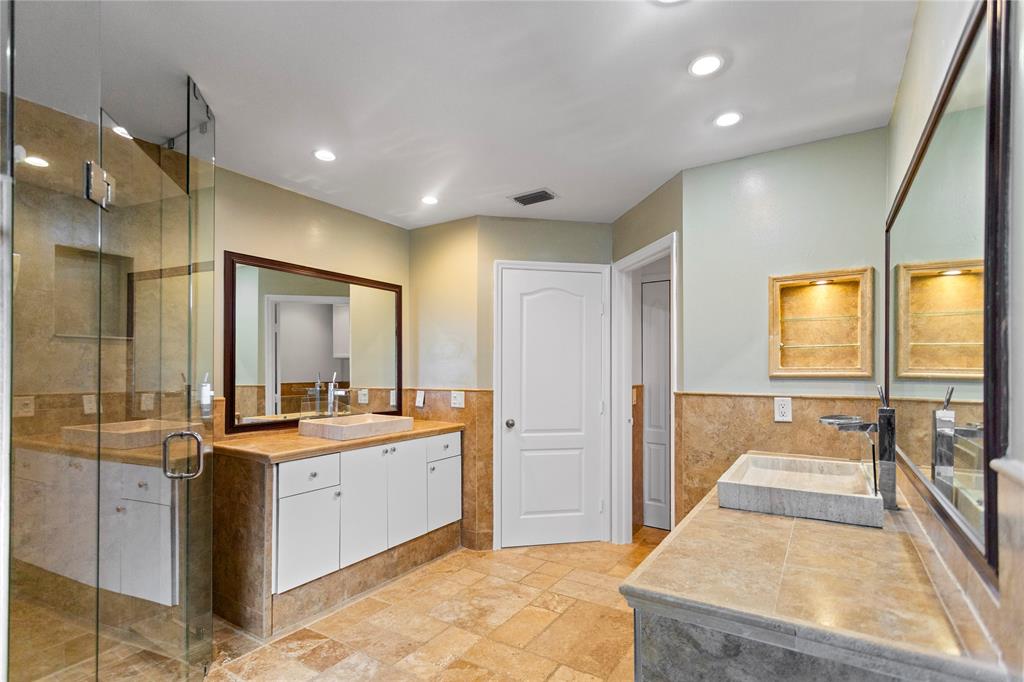 2704 Southwest 128th Avenue Miramar, FL 33027 - Photo 22 of 54 a large kitchen with stainless steel appliances a large counter top a sink a refrigerator and a view of living room