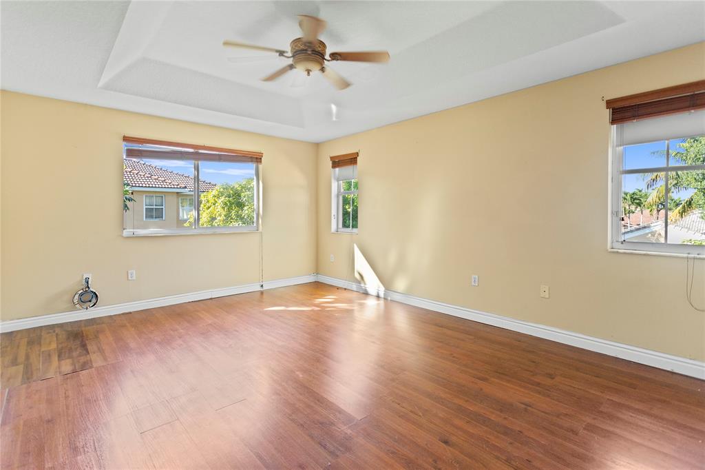 2704 Southwest 128th Avenue Miramar, FL 33027 - Photo 24 of 54 a view of an empty room with a window and wooden floor